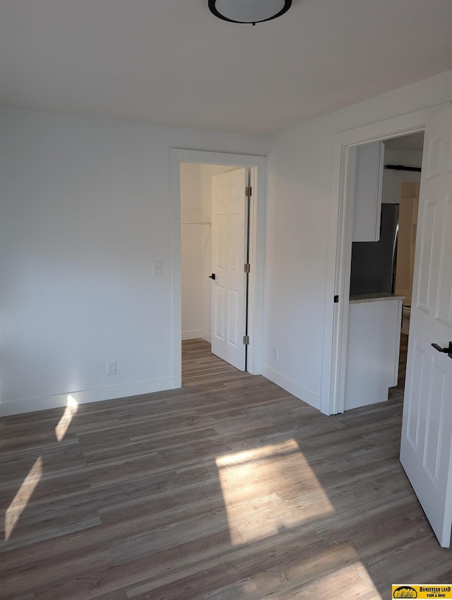 empty room featuring dark hardwood / wood-style floors