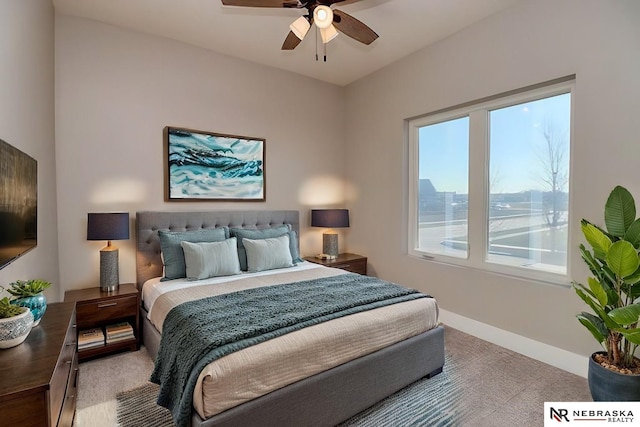 bedroom featuring ceiling fan and light colored carpet