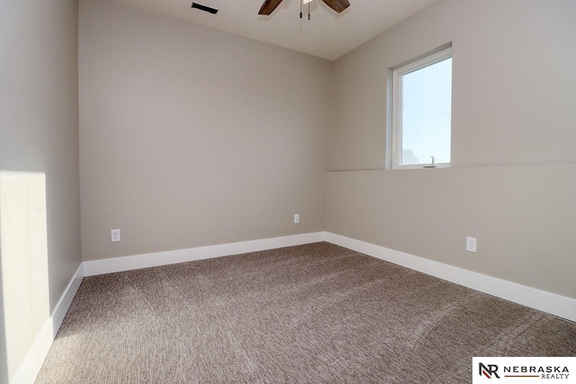 carpeted empty room featuring ceiling fan