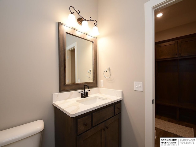 bathroom with vanity and toilet