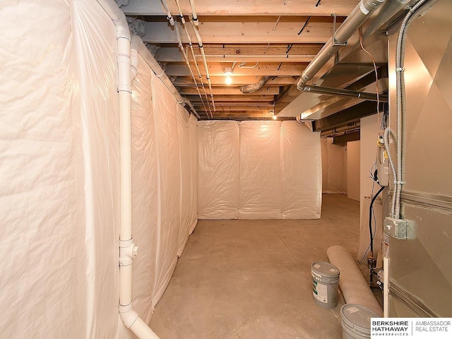 basement featuring heating unit