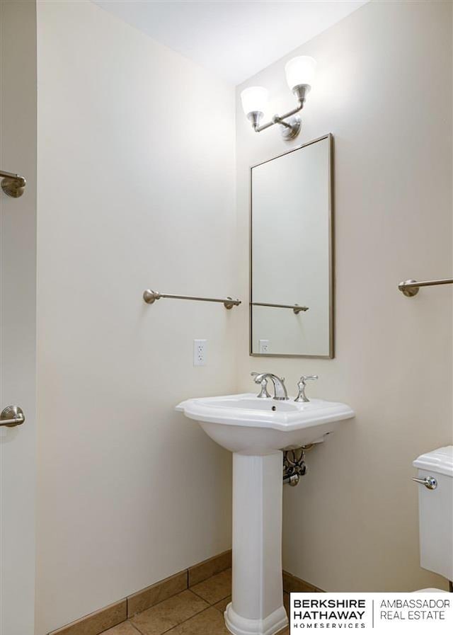 bathroom featuring tile patterned floors and toilet