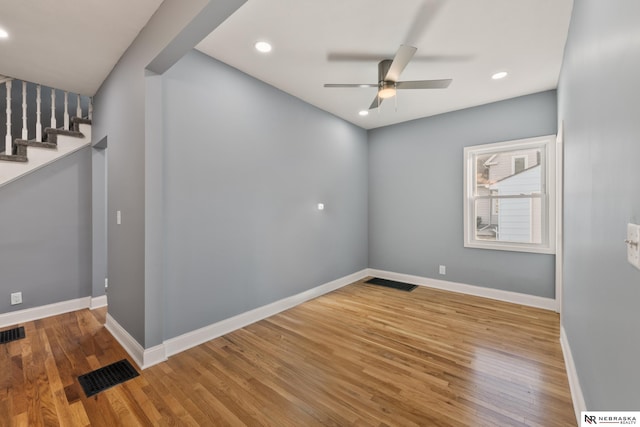 unfurnished room featuring ceiling fan and hardwood / wood-style floors