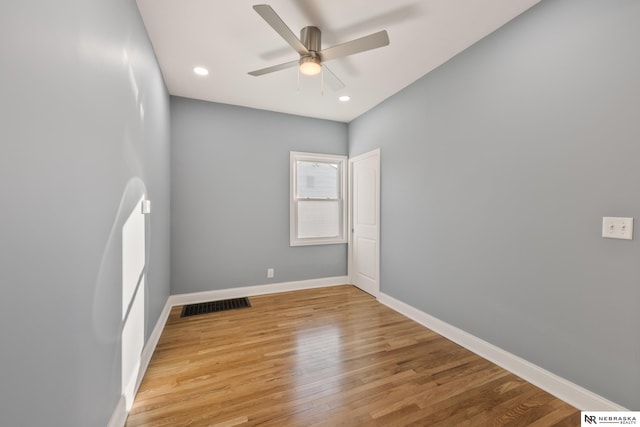 empty room with light hardwood / wood-style flooring and ceiling fan