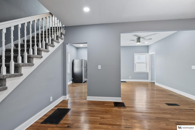 interior space with hardwood / wood-style floors and ceiling fan