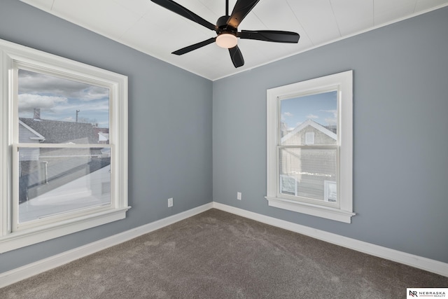 empty room with carpet flooring and ceiling fan