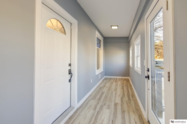 doorway to outside featuring light wood-type flooring