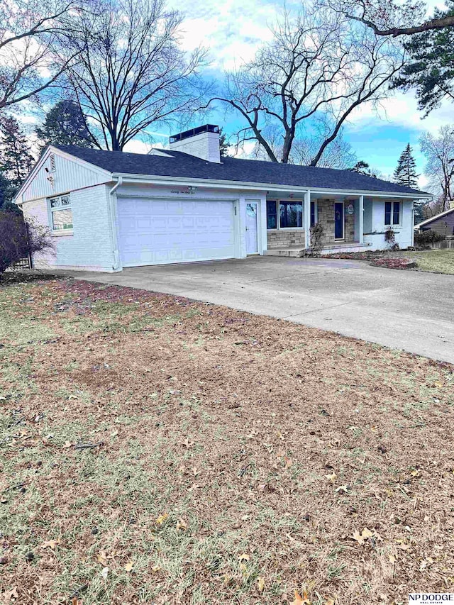 ranch-style house featuring a garage