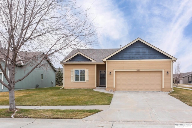 view of front of home featuring a front yard and a garage