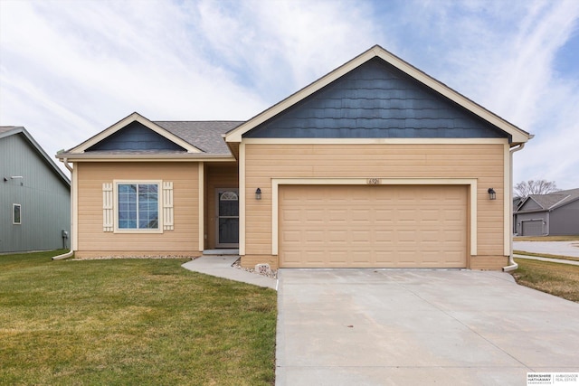 view of front facade featuring a front yard and a garage