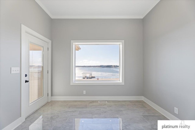 spare room featuring ornamental molding