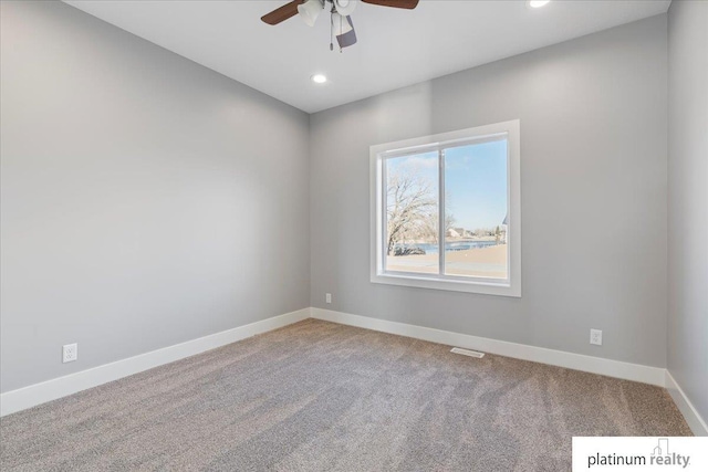 carpeted empty room with ceiling fan