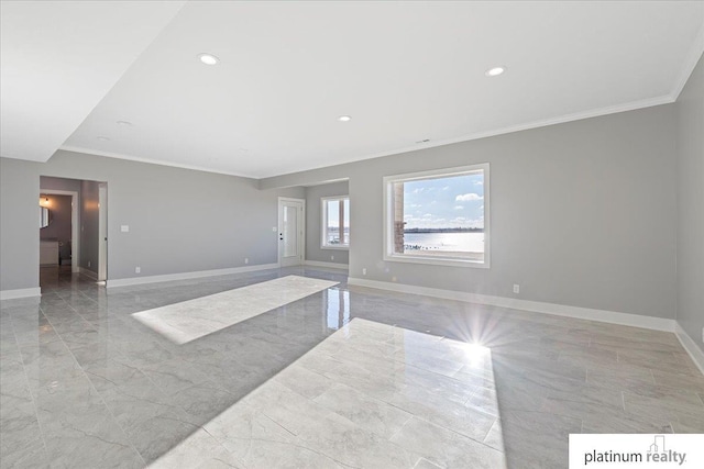 unfurnished room featuring crown molding