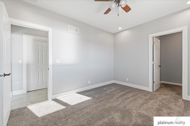 unfurnished bedroom with ceiling fan and light colored carpet