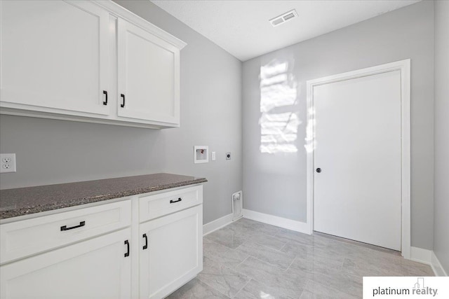 laundry room with cabinets, washer hookup, and hookup for an electric dryer