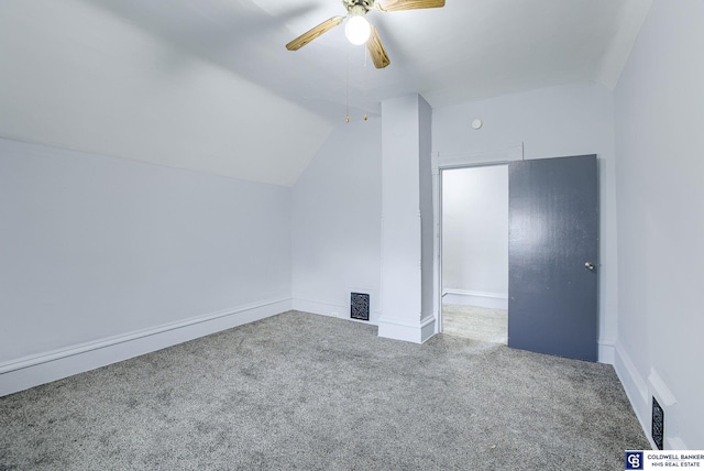 additional living space featuring carpet floors, ceiling fan, and lofted ceiling