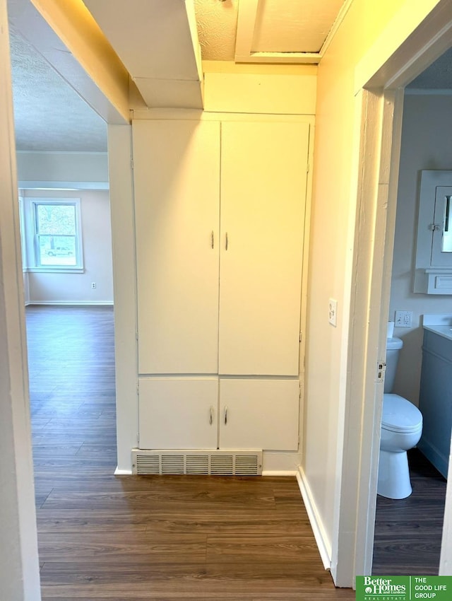 corridor with dark wood-type flooring