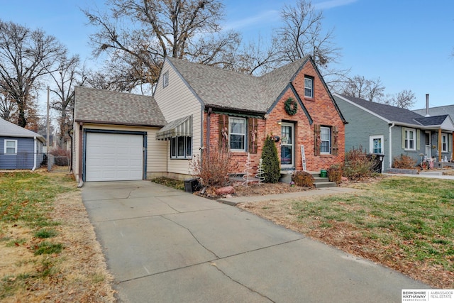 view of front of home with a front lawn and a garage