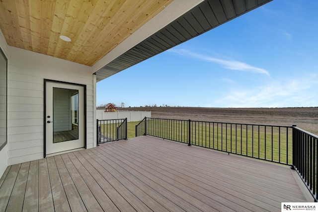 wooden terrace with a lawn