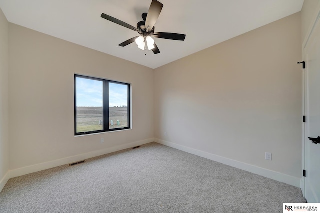 empty room with carpet and ceiling fan