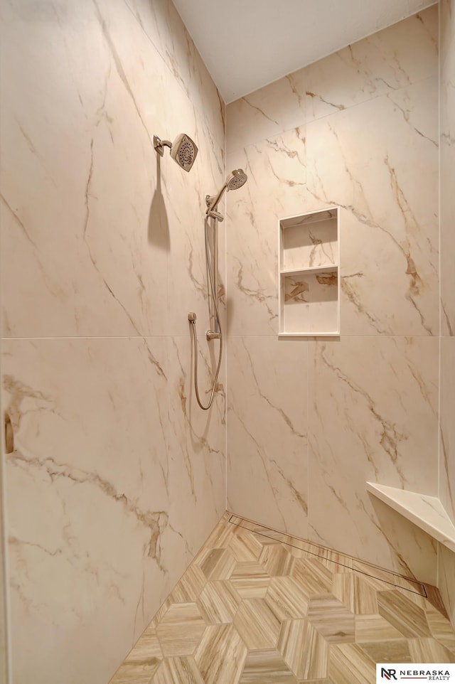 bathroom featuring tiled shower