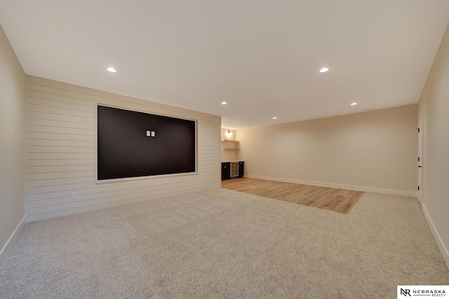 unfurnished living room with light carpet