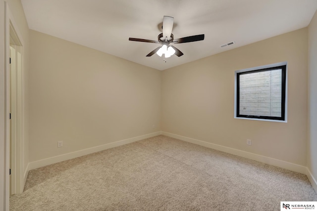 unfurnished room featuring ceiling fan and light colored carpet