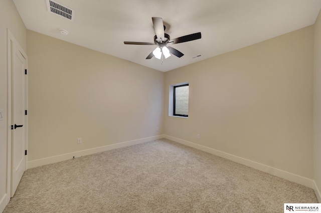 carpeted empty room featuring ceiling fan