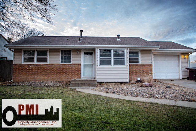 view of front facade with a garage and a front lawn