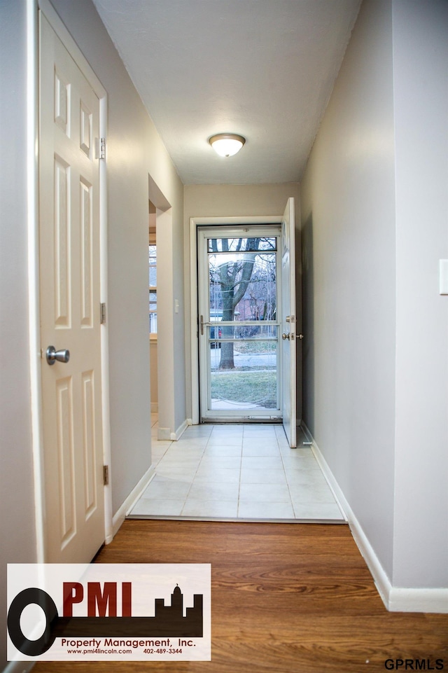 doorway to outside with light hardwood / wood-style floors