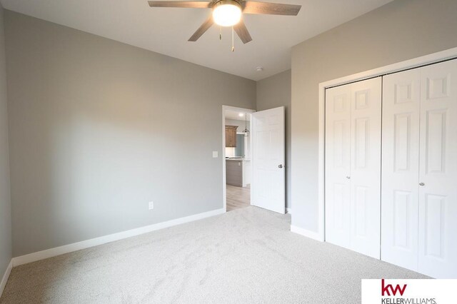 1450 Montana St, Superior, NE 68978 - unfurnished bedroom with light carpet, baseboards, a closet, and ceiling fan