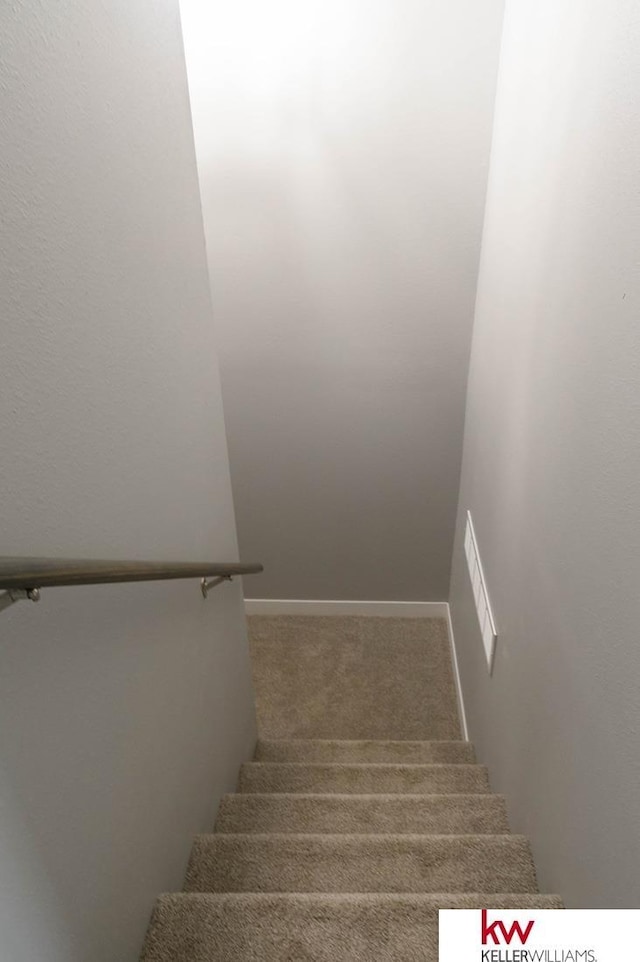 1450 Montana St, Superior, NE 68978 - stairs featuring carpet flooring and baseboards