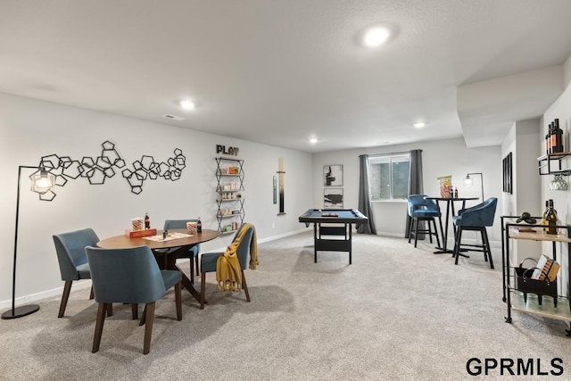 view of carpeted dining area