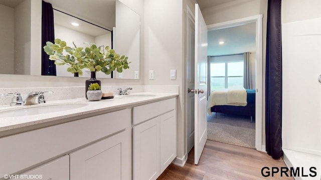 bathroom featuring hardwood / wood-style floors and vanity