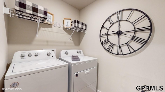 laundry area with washing machine and clothes dryer