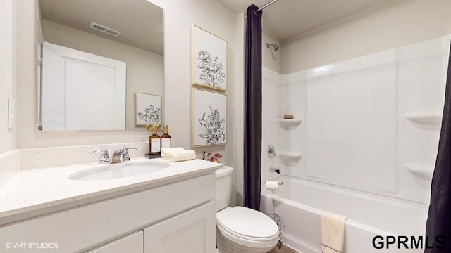 full bathroom featuring shower / bath combo, toilet, and vanity