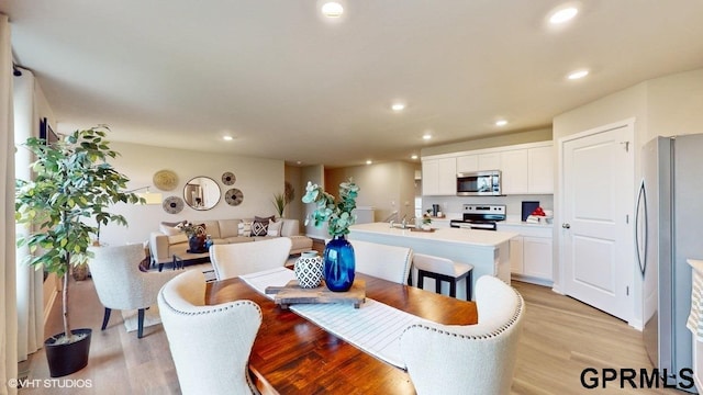 dining area with light hardwood / wood-style flooring