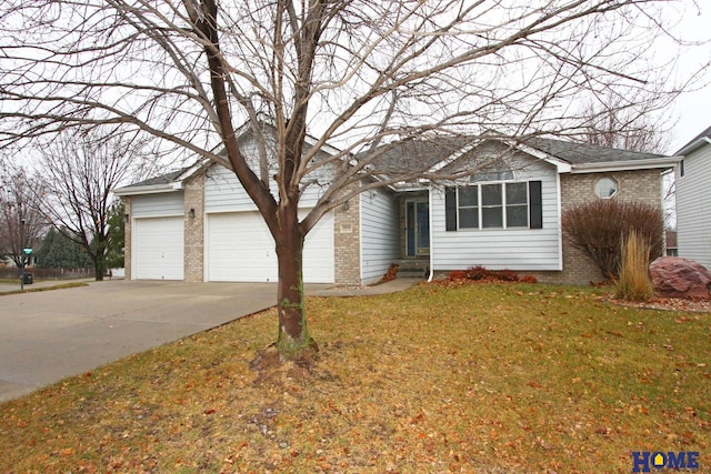 ranch-style home with a front lawn and a garage