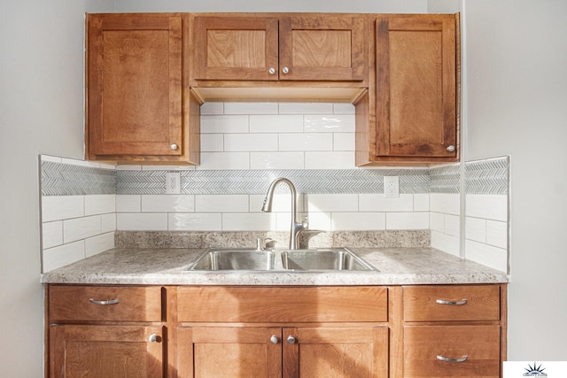 kitchen with backsplash and sink