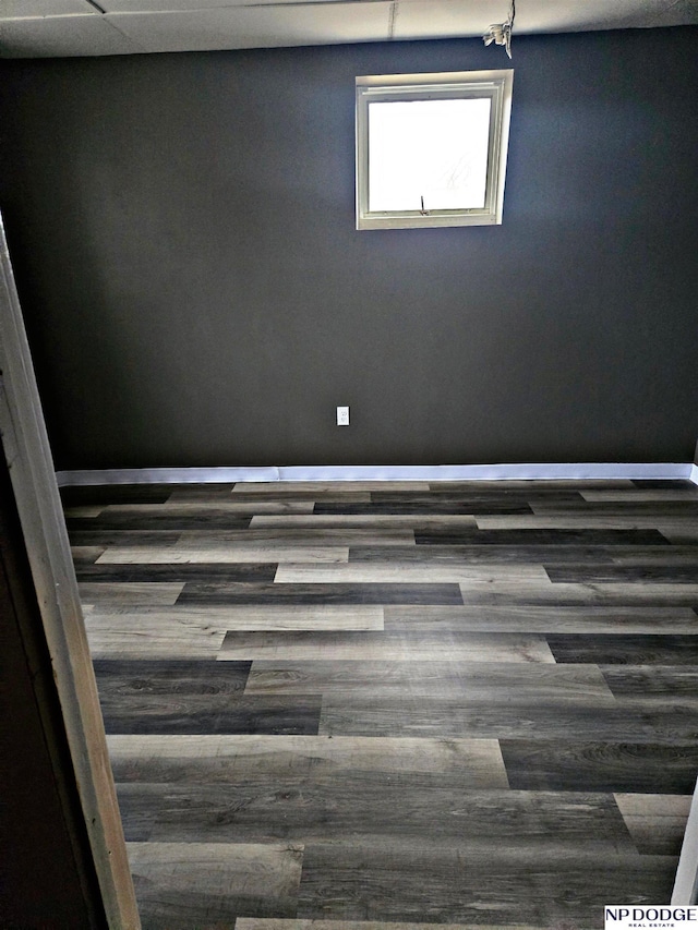 spare room with dark wood-type flooring