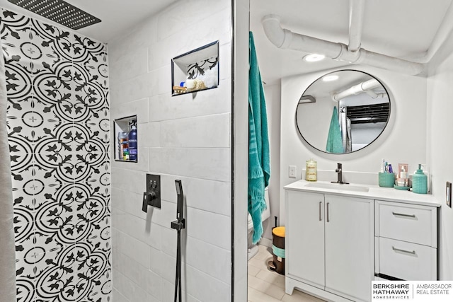 bathroom featuring vanity and a shower