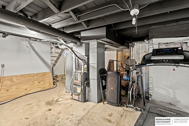 utility room featuring heating unit