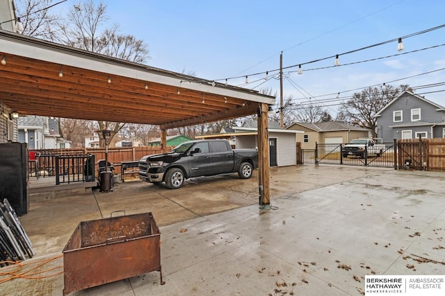 view of vehicle parking featuring a carport