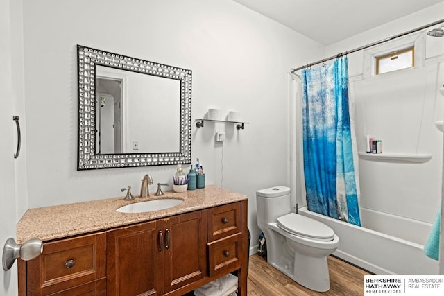 full bathroom featuring vanity, wood-type flooring, shower / bath combo, and toilet