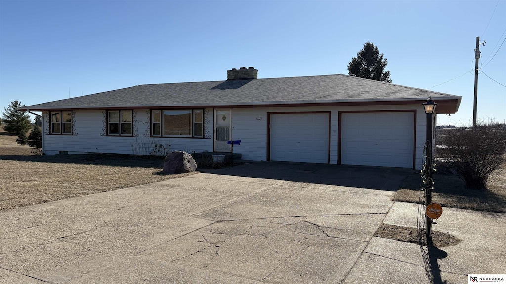 single story home with a garage