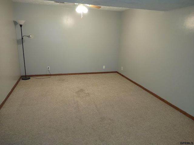 empty room with carpet and ceiling fan