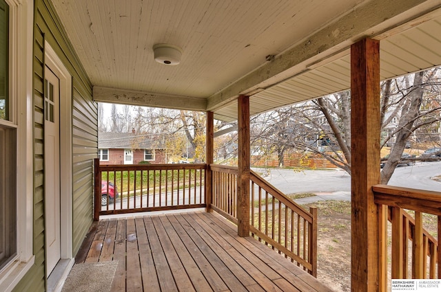 wooden terrace with a porch