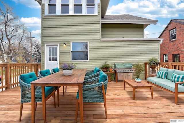 wooden deck featuring an outdoor hangout area and a grill