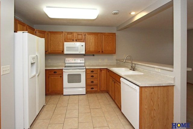 kitchen with kitchen peninsula, light tile patterned floors, white appliances, and sink