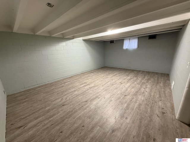 basement featuring light hardwood / wood-style flooring